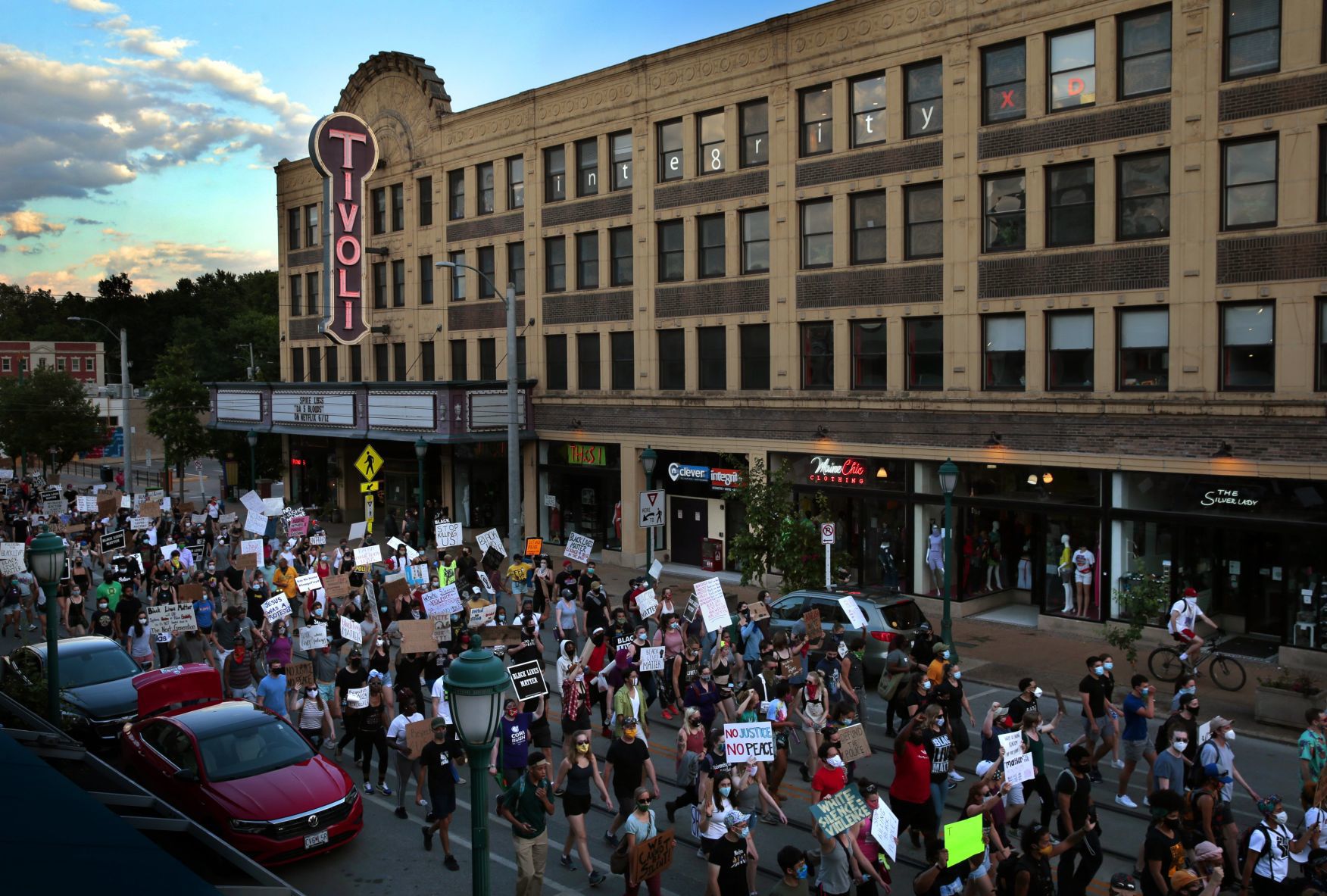 Protesters march through the Delmar Loop